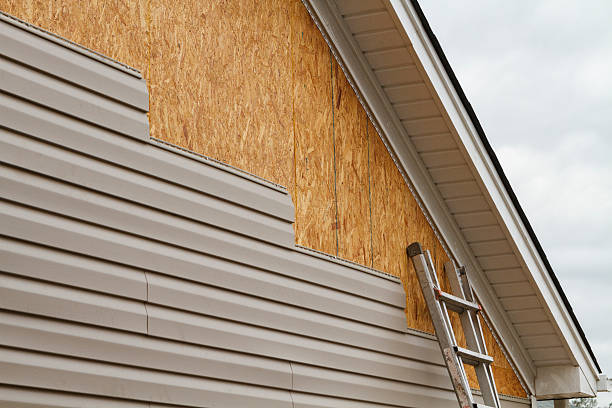 Professional Siding technician working in East Sparta, OH